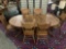 Antique style oak pedestal base claw foot dining table with 2 cleaves & 6 matching carved chairs