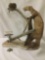 Taxidermy tableaux of a weasel and a squirrel - whimsical chase or fight scene