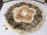 Circular rug made of a collage of different furs - fox, small mammal, etc