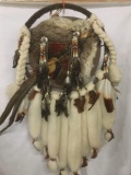 Elaborate leather and hide Native American dream catcher with feathers, metal/beads and fur
