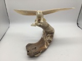 Alaskan Inuit mammoth bone sculpture of an eagle catching fish -on walrus jaw base - signed as is
