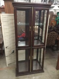 Modern lighted curio cabinet with glass shelves - good cond