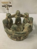 Clay Mayan style Circle of Friends candleholder, designed with figures locking arms around a bow