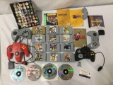 Collection of N64, PlayStation, and PC games and controllers. Goldeneye, Mario Party, Final Fantasy