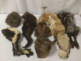 Seven fur and pelt hats, incl. fox, skunk, beaver, and more