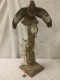 Taxidermy art piece diorama of a perched European hawk with their prey