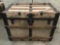 Antique wood and metal canvas covered flat top steamer trunk as is