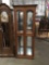 Modern curio cabinet with 3 glass shelves. Lighting tested and needs repair. Measures approx