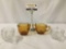 Pair of cream and sugar sets. Diamond glass 99 amber set and Fostoria American with chip.