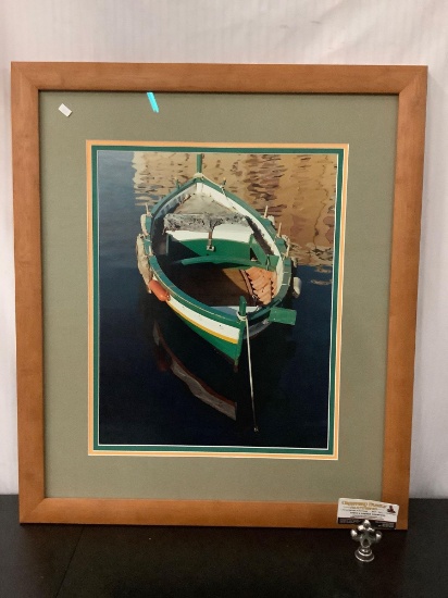 Framed photograph of small wooden boat, approx 27x30 inches.