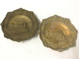 Pair of antique Cast metal Plates with Castle Scene. One is marked OAC. 11.5 inches