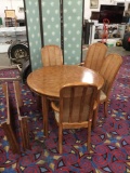 Mid century Drexel Passage Collection table with four Drexel leopard print seats and rush backs