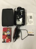 90s Oster professional hair clipper set with VHS tape and accessories.