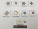 Eight collectible U.S. coins, incl. WWII coins, a buffalo nickel, dollar coins, and others.