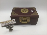 Small Asian wooden jewelry box w/metal hardware and embellishments. Box is locked and key is not