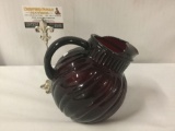 Unmarked vintage red glass pitcher.