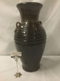 Large brown glazed vase.