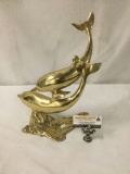 Gold tone metal dolphin sculpture