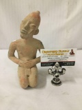Stoneware figural statue of kneeling man. Has been repaired at arms.