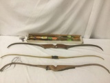 Three wooden bows, incl. two Ben Pearson bows, w/over 35 arrows, approx. 57x7x2 inches each.
