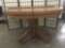 Antique early 1900s round oak dining table w/one leaf, approx. 48.25x48.25x29 inches collapsed and
