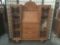 Vintage three drawer secretaries desk/curio cabinet, one cabinet door is locked shut w/dolls inside