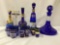 20 pieces of blue and gold glass drinkware. One decanter has chip. Largest decanter measures approx