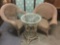 Pair of wicker patio chairs and a bamboo glass top patio table. Largest chair measures approx