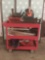 Three tray red service cast full of hand tools, electric planer, dirt devil and more. Cart measures