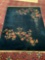 Vintage 100% wool rug with floral pattern. Has some damage. Measures approx 137x103 inches. MB