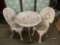Set of vintage metal patio furniture, two chairs and a table. Table measures approx 27x27x25 inches.