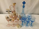 Collection of 7 blue glassware pieces and 7 rose and gold glassware pieces. All made in Hungary.