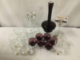 Collection of 7 Italian purple glass stemware, and 9 pieces of Romanian stemware. Largest decanter