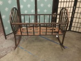 Antique wooden rocking cradle. Measures approx 36x28x27 inches. MB