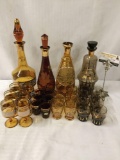 Four collection of 7 cups and decanter of Amber glass. Bohemia and more! Largest decanter measures