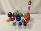 13 pieces of colored crystal stemware. Made in Germany, hand cut. Decanter measures approx