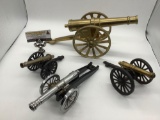Lot of 4 metal cannon replicas, one marked: made in USA, largest approx 15x6x7 inches. BK