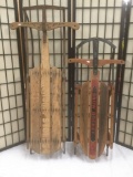 Two vintage wood and metal sleds, incl. one Snow Rocket & one sled with an obscured brand, shows