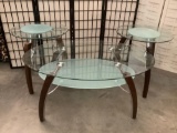 Pair of modern glass top end tables and a coffee table with wood and metal legs. End table measures