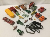 Eight metal toy vehicles and a bunch of misc. toy car accessories, incl. a vintage red diecast U.S.