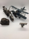 Two metal toy vehicles and a metal coin bank, incl. a tin biplane toy w/some mild wear, a scrap