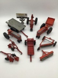Three diecast toy tractors & seven pieces of mountable metal and plastic farm equipment. Incl. two