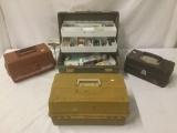 Four tackle boxes full of fishing weights, hooks, fishing line, and other gear. Tackle box brands