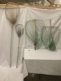Four large fishing nets, incl. three unmarked nets and one Lin-Line net w/ a Hunt Wilde handle.