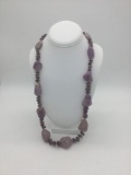 Large necklace featuring many amethyst stones. It weighs 213.6 grams. Measures approx 30 inches.