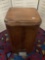 Vintage wooden trash can with step activated lid, approx 13 x 12 x 24 inches.