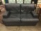 Chateau DAx Navy blue leather loveseat. Made in Italy. Measures approx 60x36x32 inches.