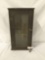 Antique medicine cabinet with glass window door and wooden shelves.