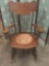 Antique 1800s upholstered seat oak spindle rocking chair.