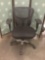 Mesh back swivel adjustable office chair.